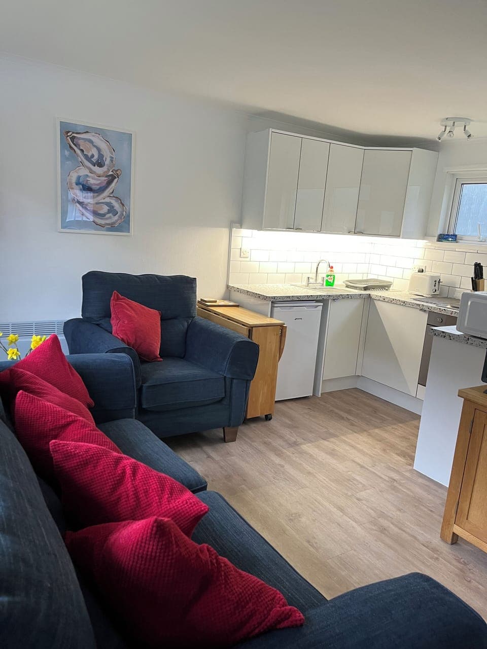 Living room with adjoining kitchen