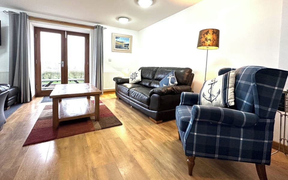 Living Area with double doors onto the patio area 