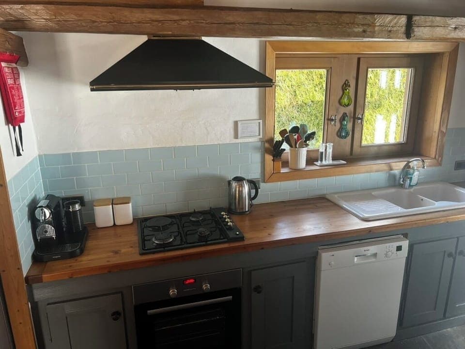 Kitchen with Nespresso machine, fridge freezer, dishwasher, microwave etc