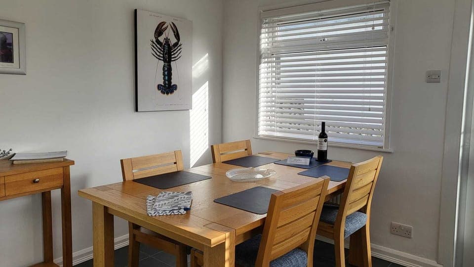 Dining table in the kitchen with a little treat on arrival