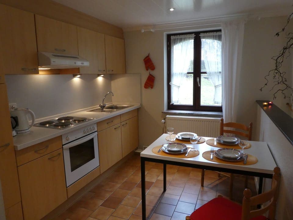 Well equipped kitchen and dining area