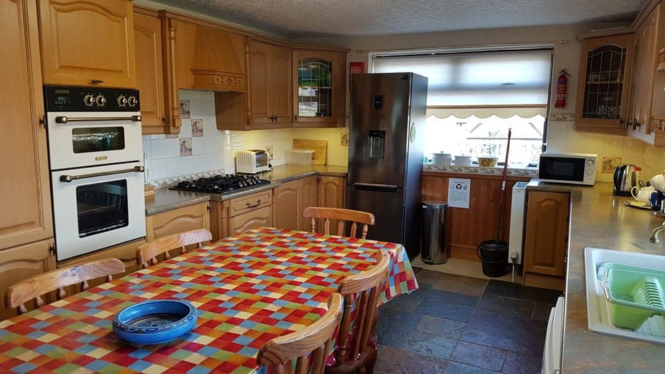 Farmhouse style kitchen & dining area, well equiped for cooking & laundry