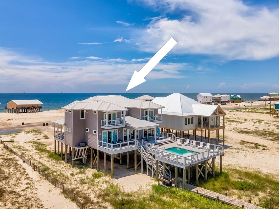 Elevated beachfront rental home with private pool, just steps from north beach.