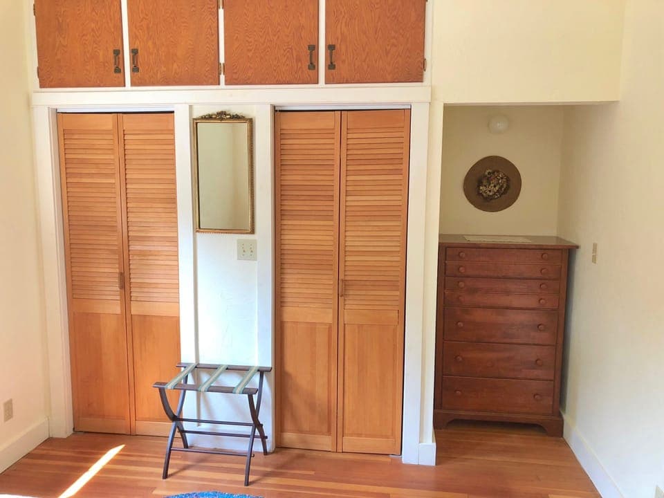 Closets and dresser in bedroom. Left closet has supplies, right is for guests!