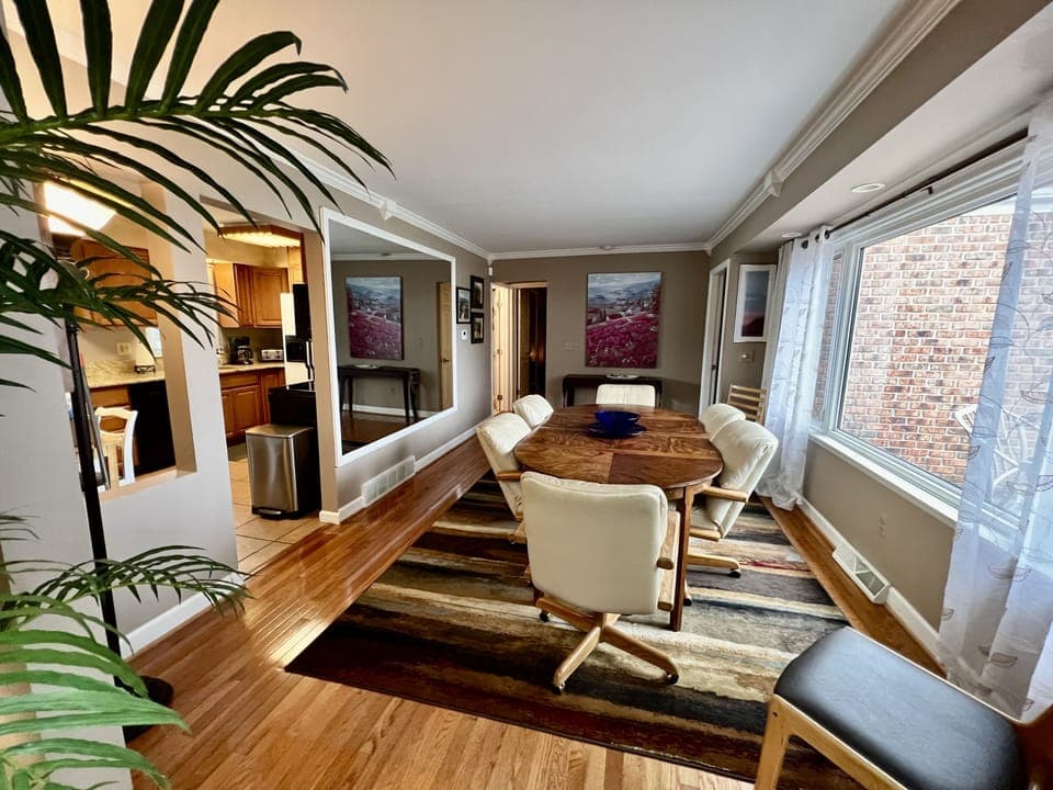 The Dining Room and an additional table and chairs in the adjacent Kitchen.