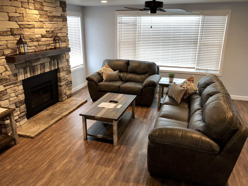 Living room with 55" TV and Gas fireplace. Has pull out couch. 