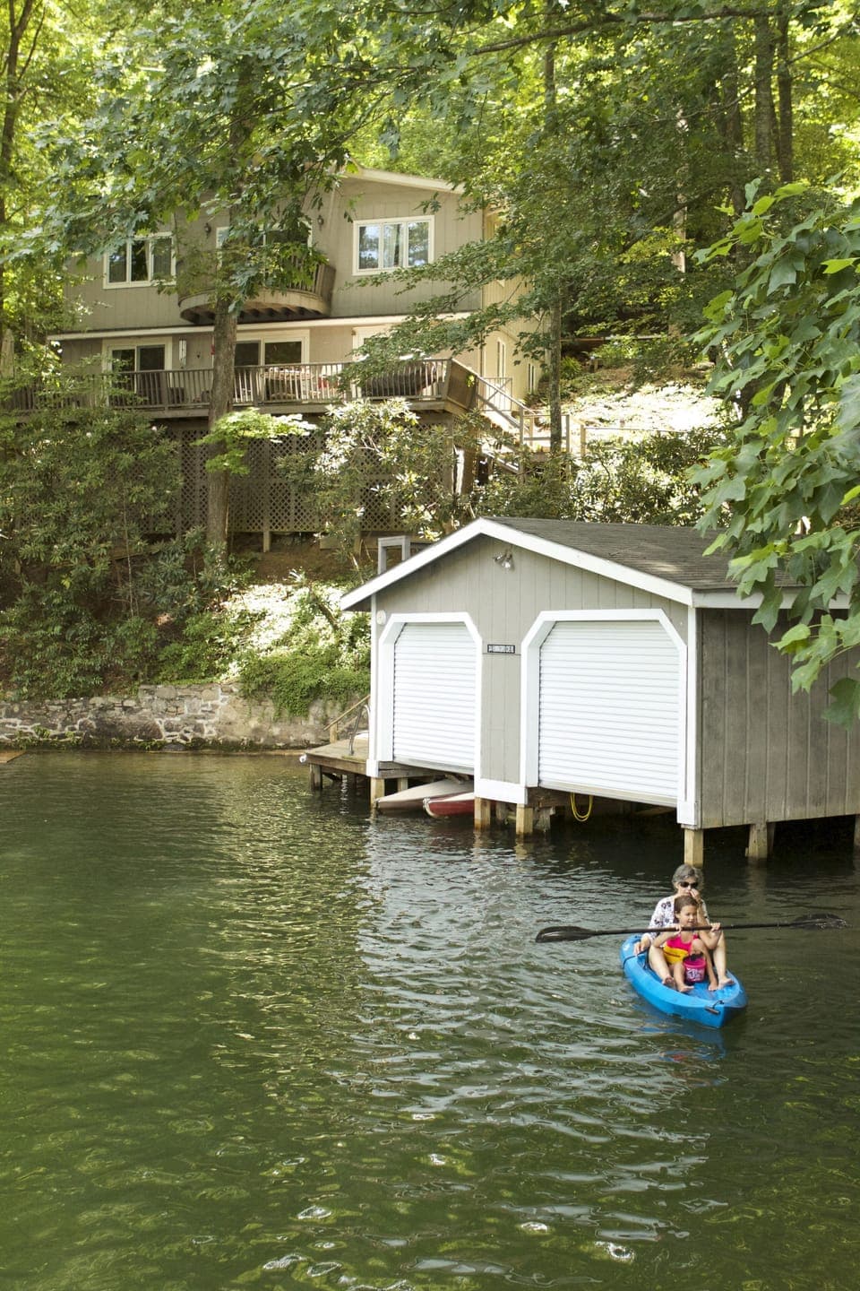 View of the house and boathouse from the lake.