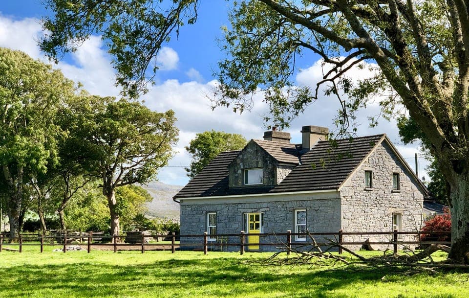 Bayfield House taken from the field in front with the Burren Hills behind