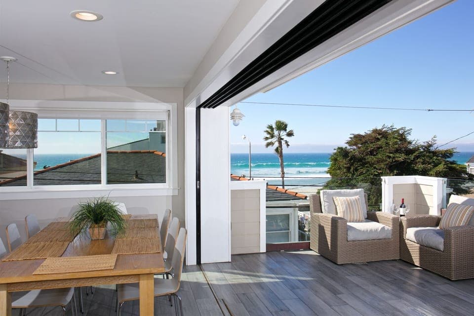 Upper unit: Beautiful open living space with open deck on main level