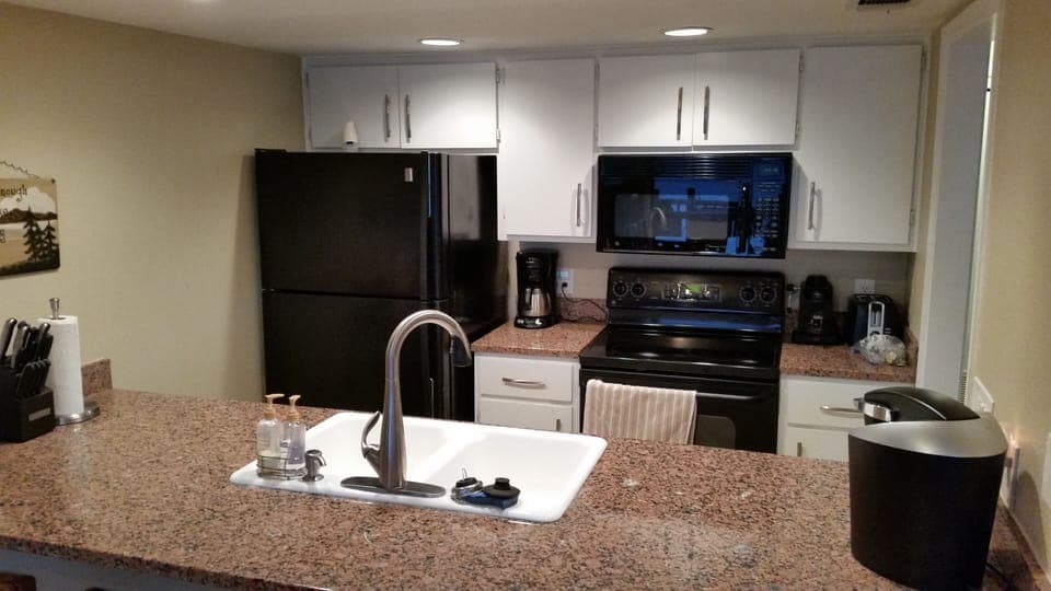 Kitchen w/matching appliances, granite counter, Keriug, etc.
