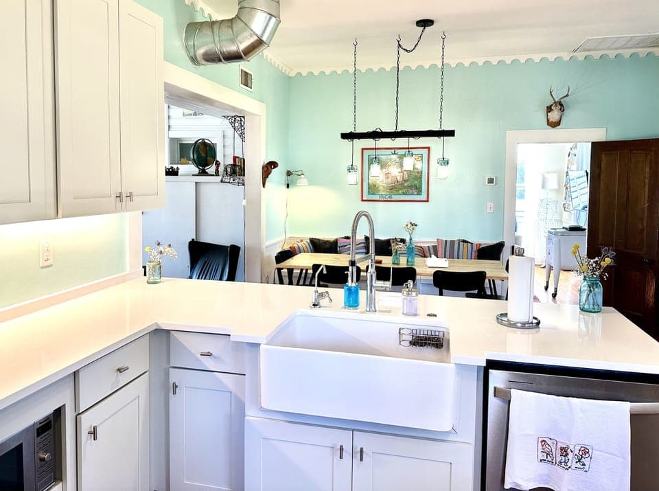 Updated kitchen with large capacity fridge, MW, dishwasher & 5 burner stove.