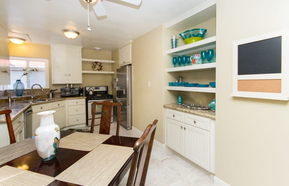 Kitchen with stainless steel dishwasher, gas range and refrigerator