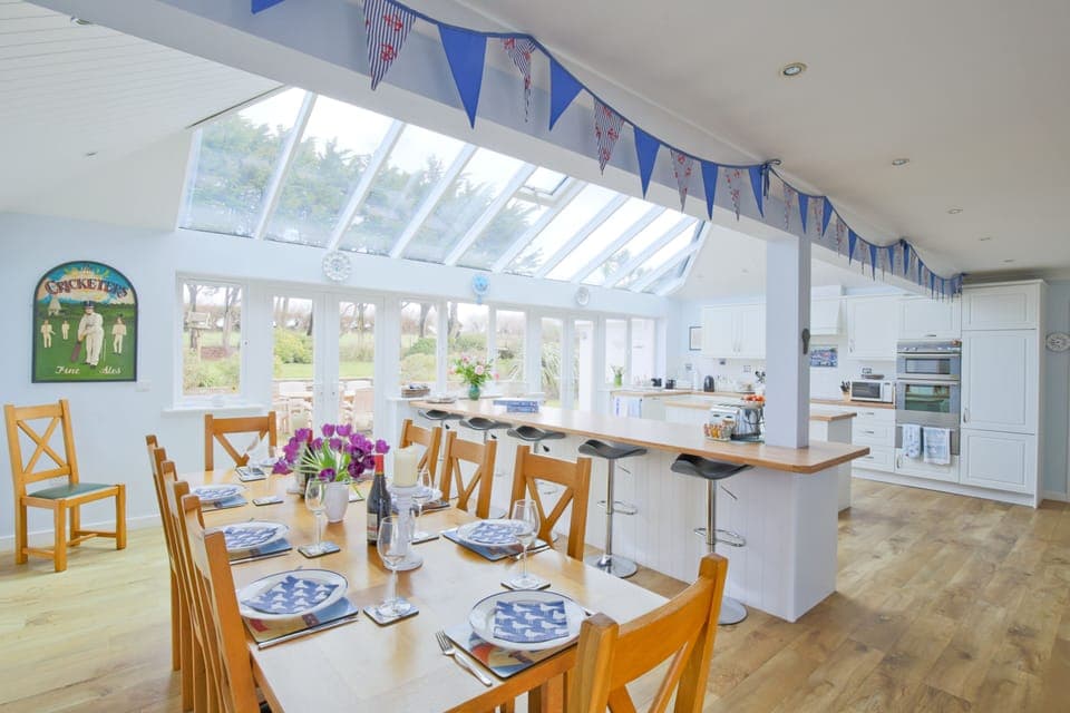 Large kitchen and dining area leading into the back garden