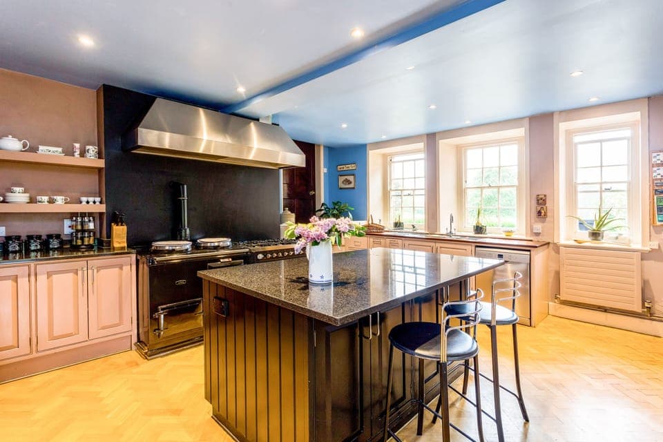 Kitchen with an Aga and 8 burner Britannia gas stove