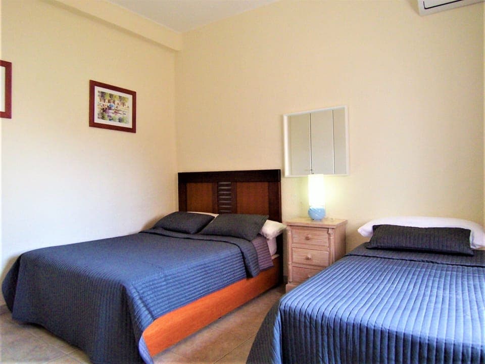 Bedroom Five with King Bed and Single Bed