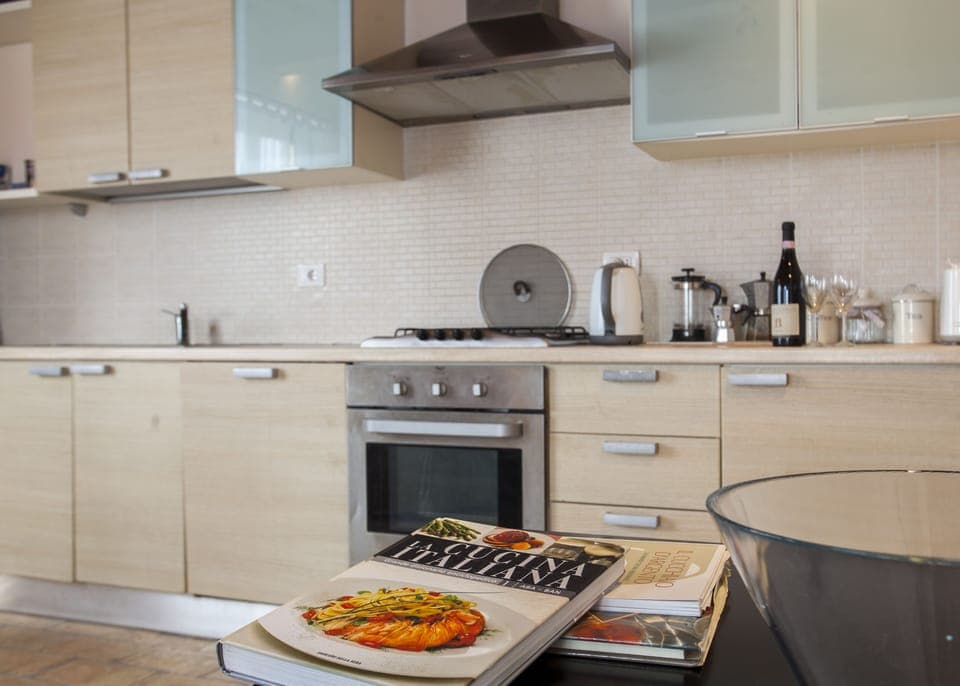 Downstairs a modern kitchen with dishwasher and washing machine oven microwave