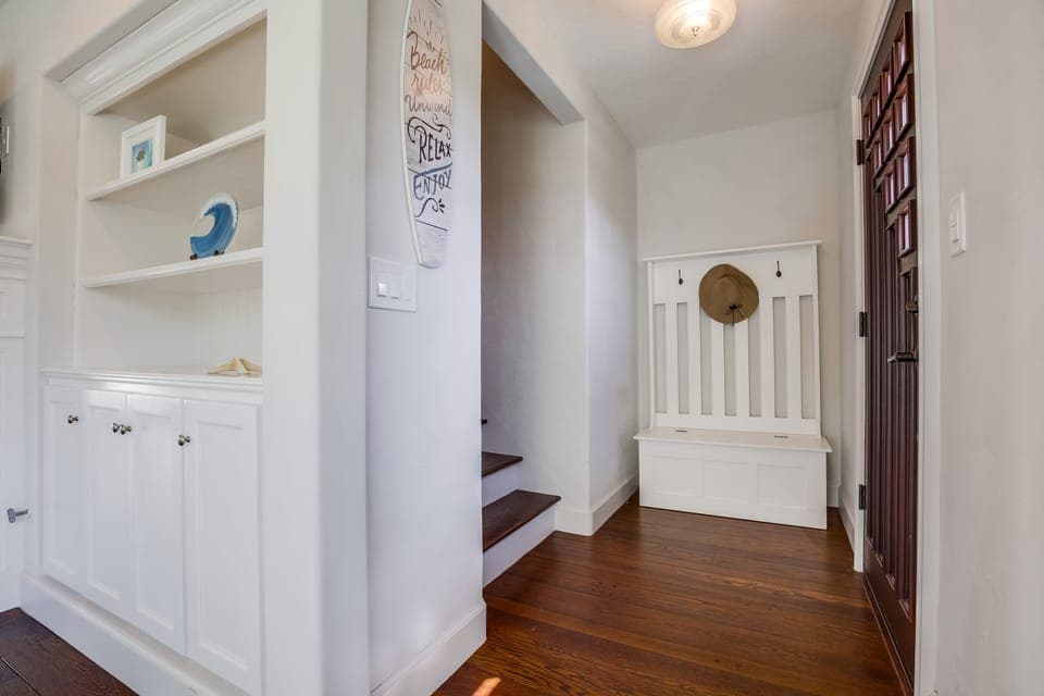 Front entrance leading into living room and upstairs.