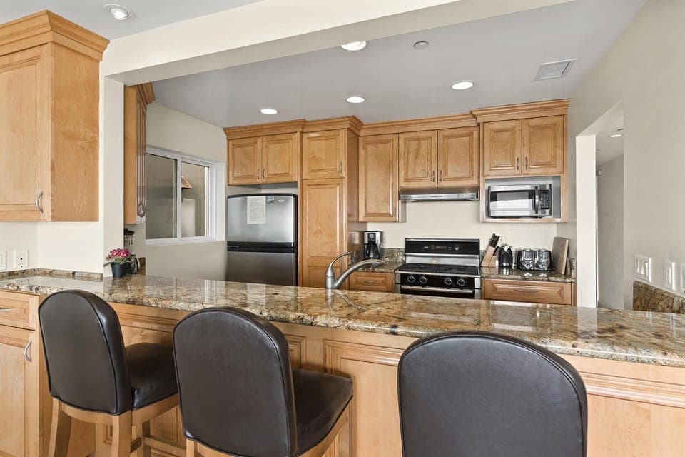 The breakfast counter includes bar stool seating, making meal prep a social affair!
                