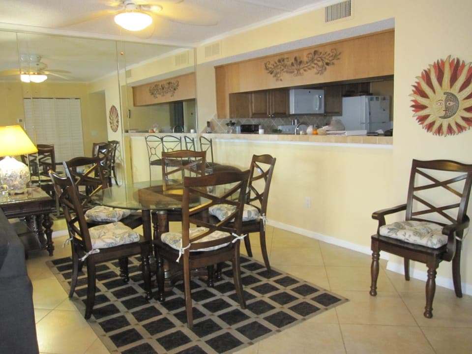 Dining room showing 6 new chairs with cushions (2022) and table.
