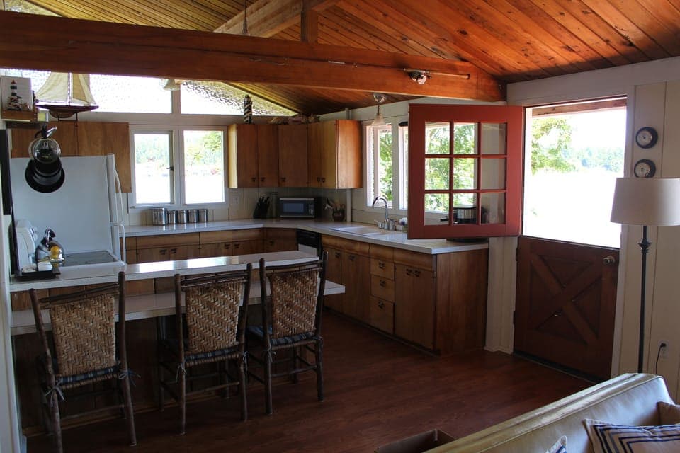 Kitchen and breakfast bar with seating for 5.  Dutch door out to the deck.