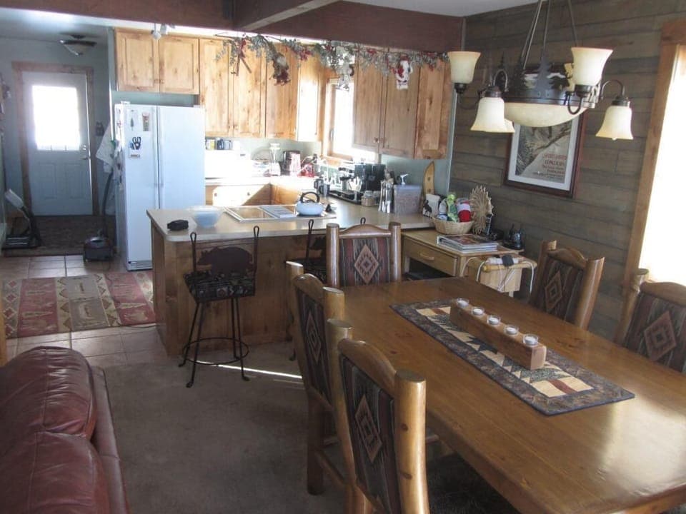 2014 View of Dining Room, Kitchen and Entrance Door as seen from Deck Access.