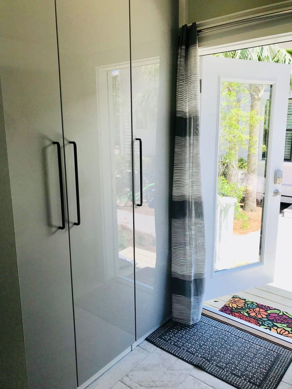 Side entry. Storage for beach towels and broom closet.