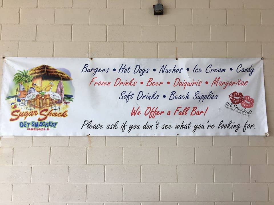 Snack bar offers burgers, hotdogs, and a full bar menu