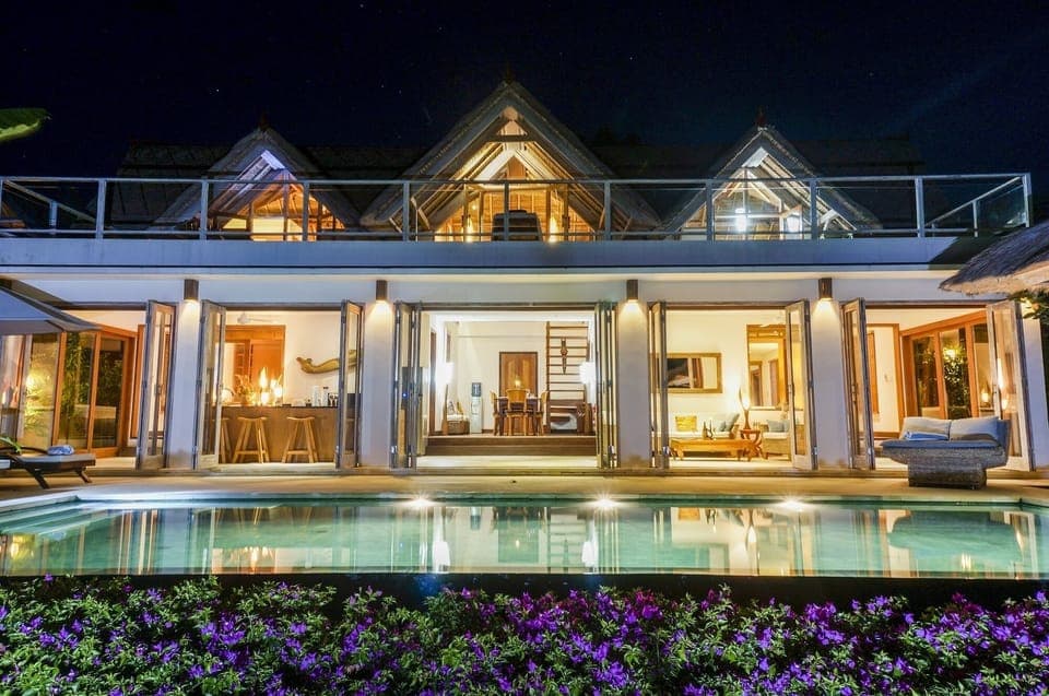 Villa and pool at night
