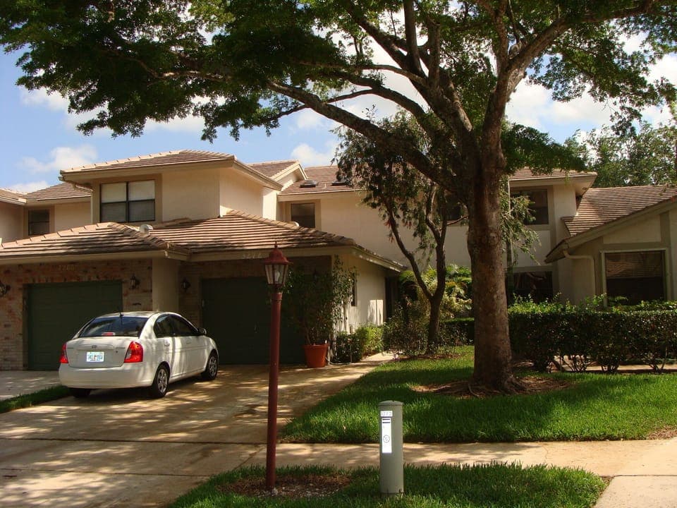 House front view single car garage and driveway for additional 2 cars