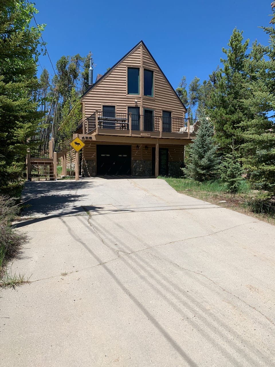 Long sloping driveway - 24' at the widest, 47' from stairs to end of driveway.