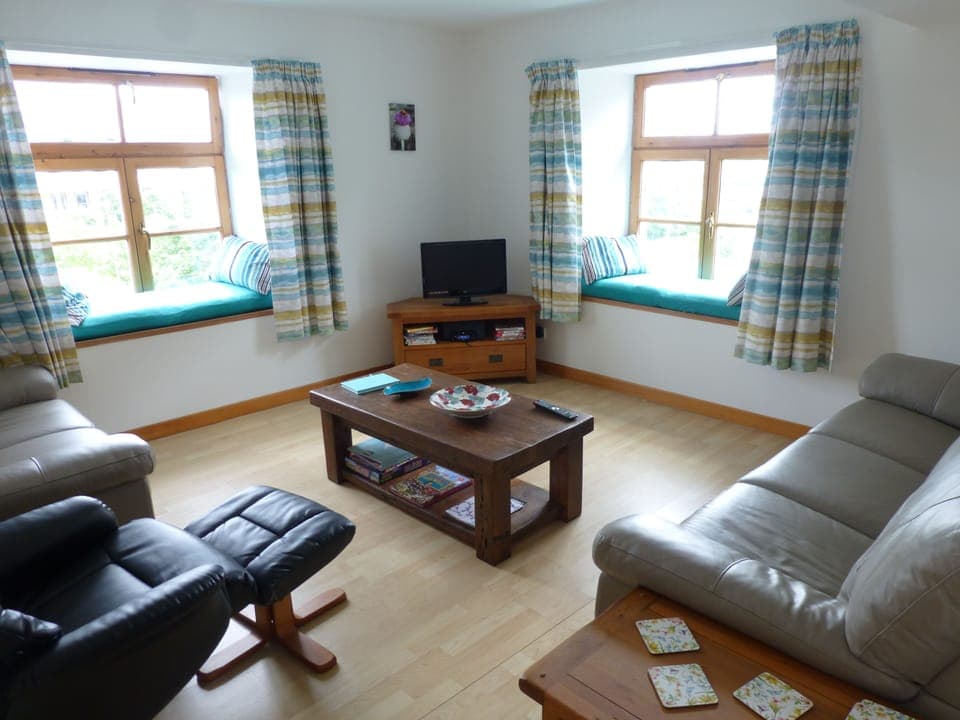 The living-room is dual aspect with window seats