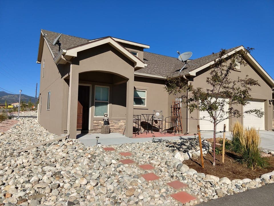 Front of Townhome, 1 car garage. Watch hummingbirds on Front patio!