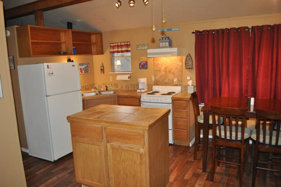 Rolling island provides extra counter space for food prep.