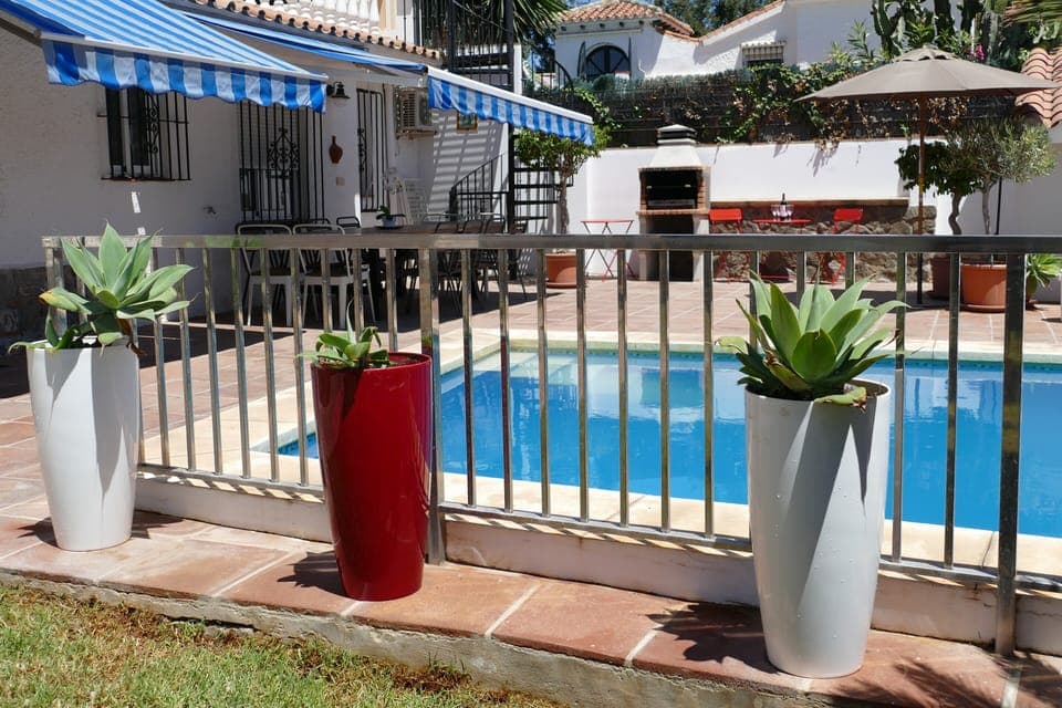 Pool area is fenced for safety.