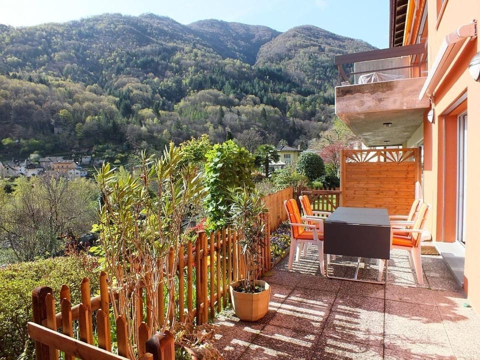 Sheltered, enclosed garden patio in front of the apartment