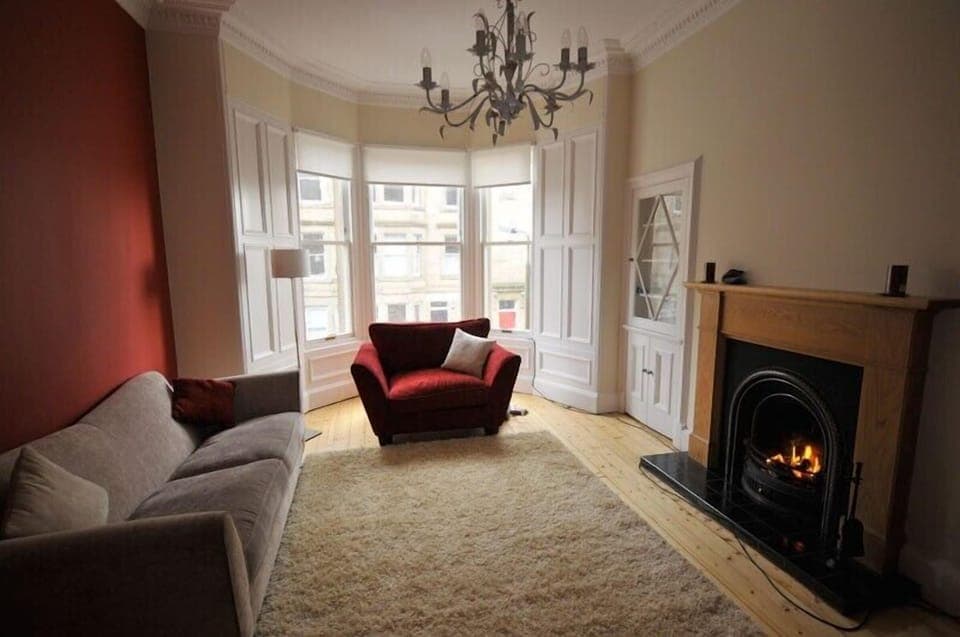 cosy lounge with open fire and bay window