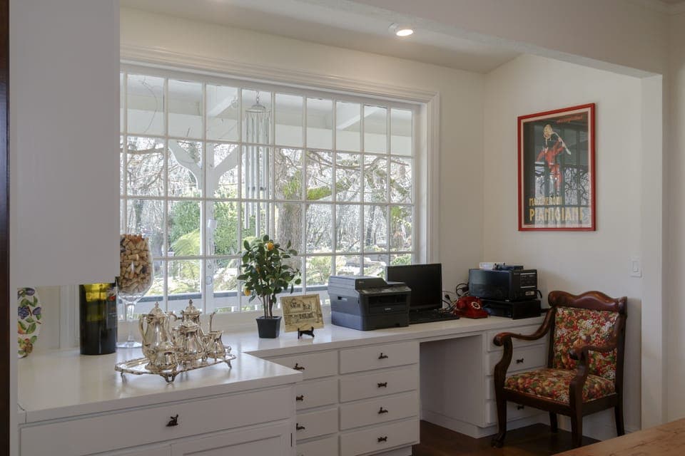 Built-in desk creates office area at side of DR, with computer, copier, WiFi etc