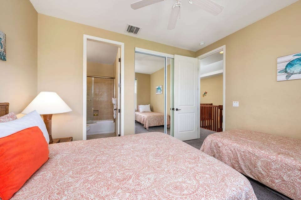 Guest bedroom features one full and one twin bed