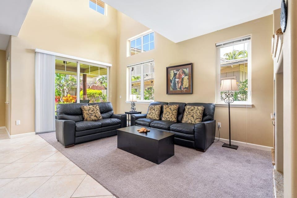 Sunlit, airy living room with sofas