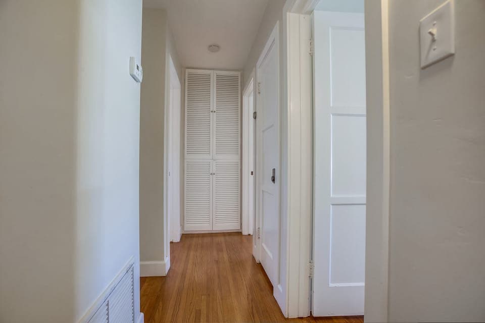 Hallway between the kitchen & entry into the 3 bedrooms.