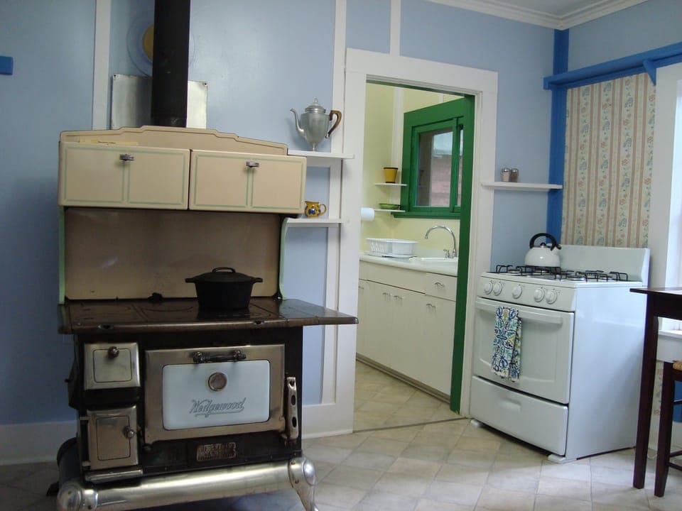 Antique Wedgewood wood range in large country kitchen