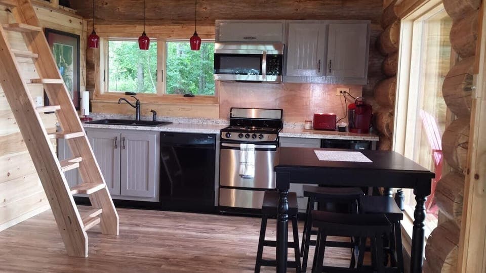 Full kitchen includes stove, dishwasher, microwave, and 2 mini-fridges.