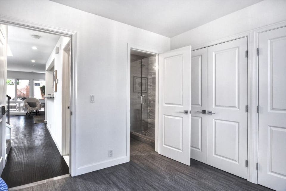 Downstairs guest bedroom entrance to its own bathroom