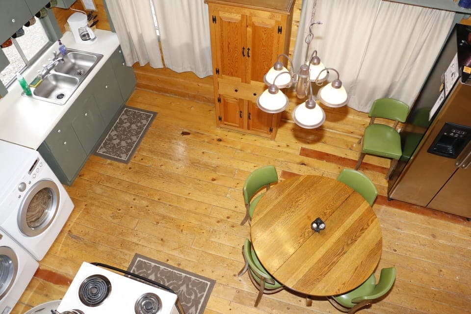 Spacious kitchen is well stocked and full of rustic details. 