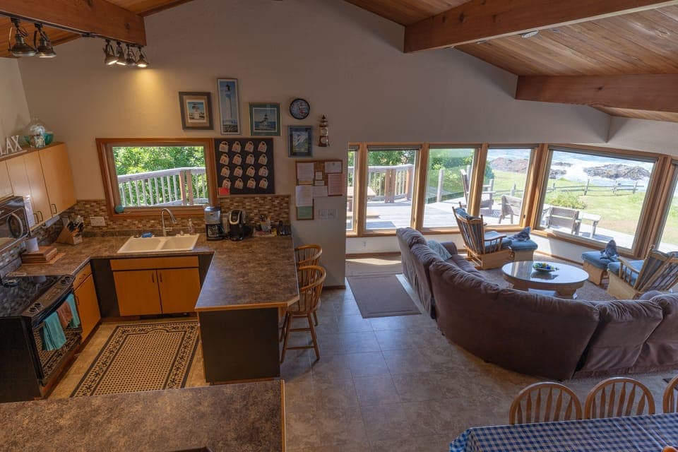 From the upper level, the well stocked kitchen with breakfast bar seating for 2.