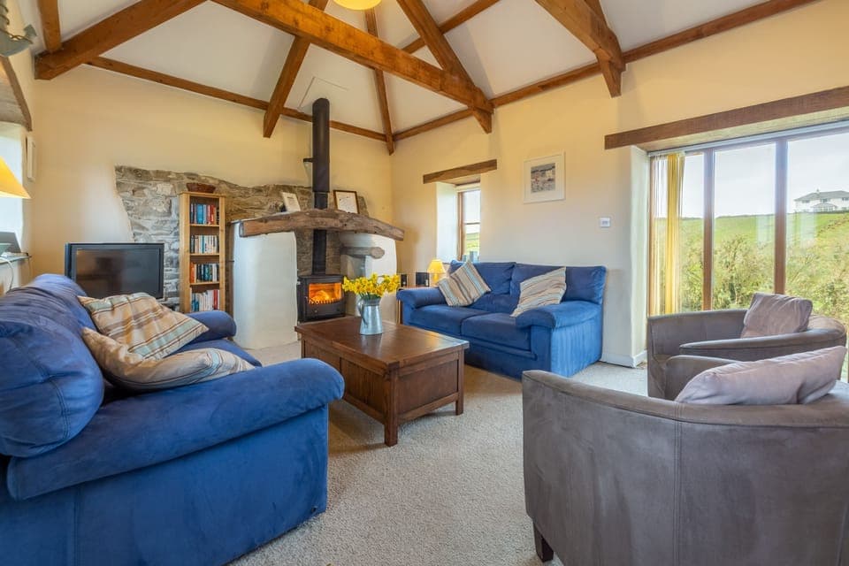 Spring Barn, Rock. First floor: Sitting room with feature fireplace and wood burning stove