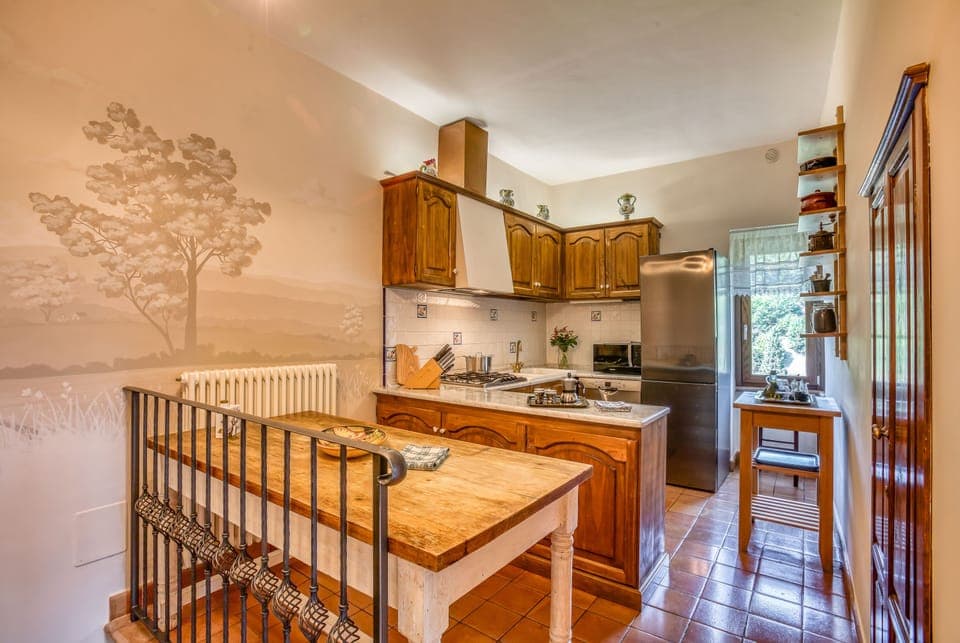 Well-appointed, high-end appliances and cookware. Another mural by local artist!