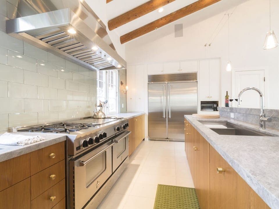 Gourmet chefs kitchen with double range, over sized fridge, 2 sinks & dishwasher