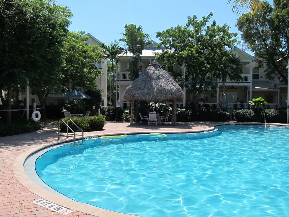 Pool with tiki hut.