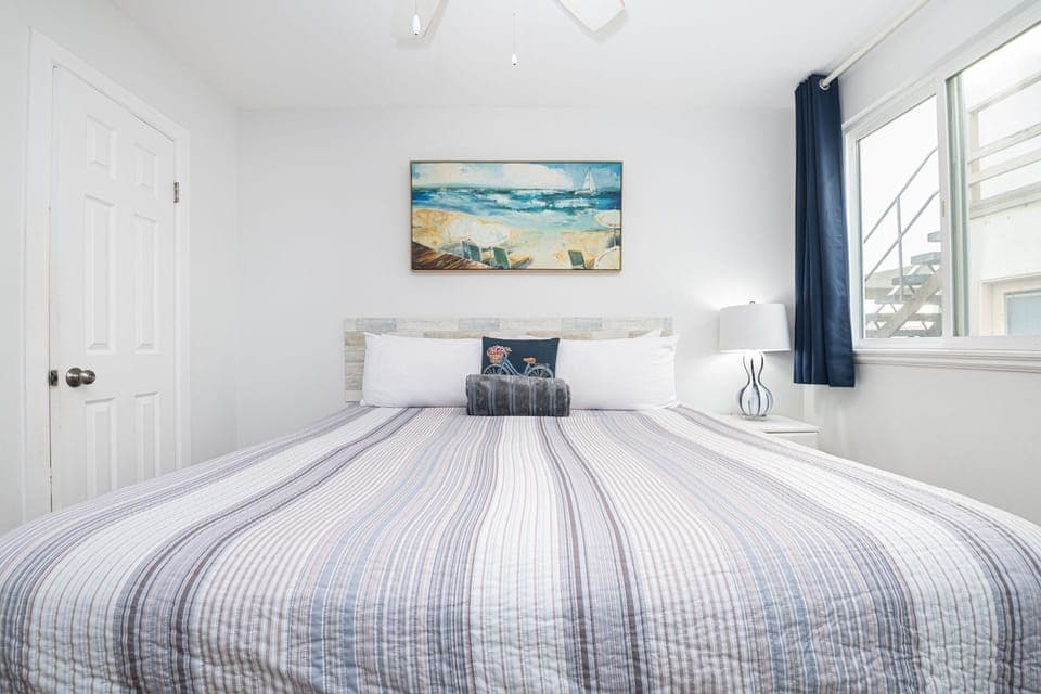 Clean lines, soothing hues, and inviting linens come together in this tranquil third bedroom
                